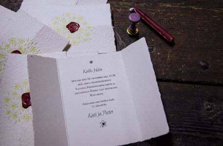 Letterpress printed wedding invitation on handmade paper with wax seal